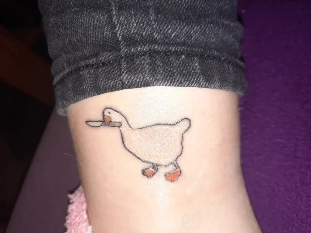 duck with knife tattoo